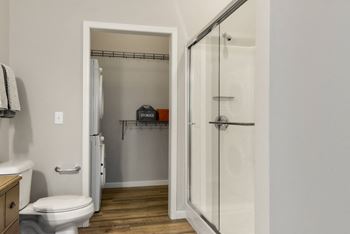 a small bathroom with a shower and a toilet